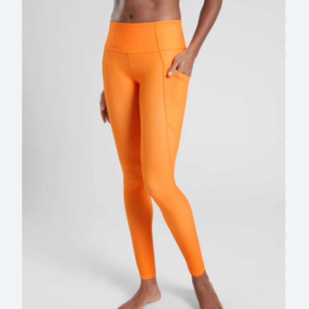 Athleta Stash Pocket Salutation Tights Sunrise Orange
